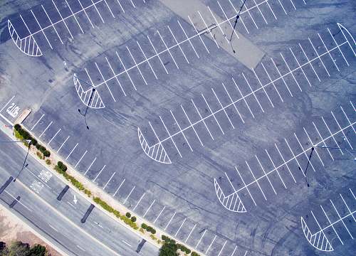 road bird's eye view photo of gray road drone view